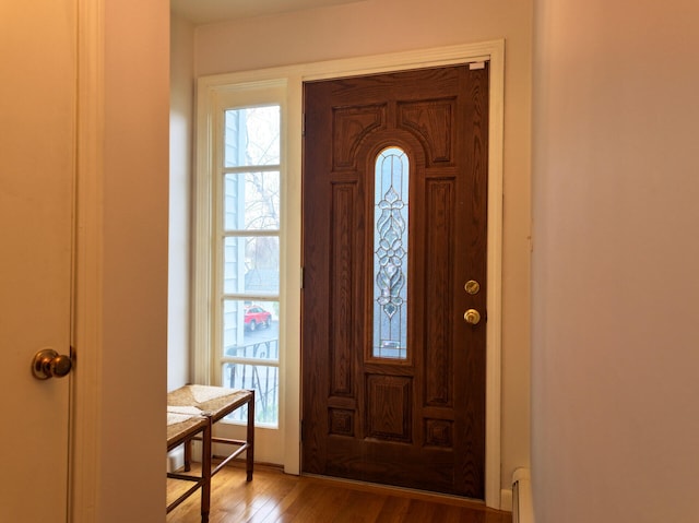 11 Moreau Ave, Lewiston, ME 04240 - foyer featuring light wood-style floors and a baseboard radiator
