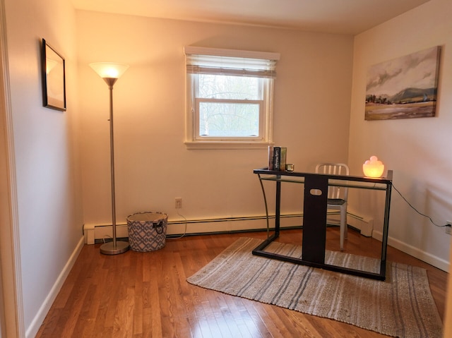 11 Moreau Ave, Lewiston, ME 04240 - unfurnished office with wood finished floors, baseboards, and baseboard heating