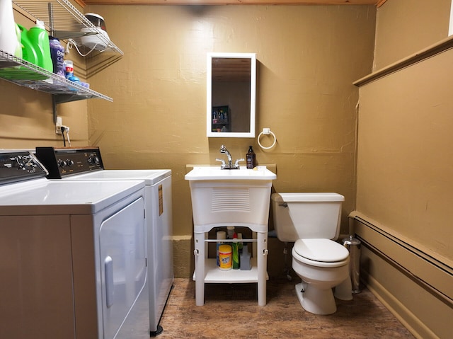 11 Moreau Ave, Lewiston, ME 04240 - laundry room with washing machine and clothes dryer and a baseboard radiator