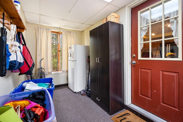 interior space with carpet flooring and baseboards