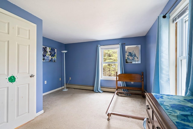 bedroom with carpet floors and baseboards