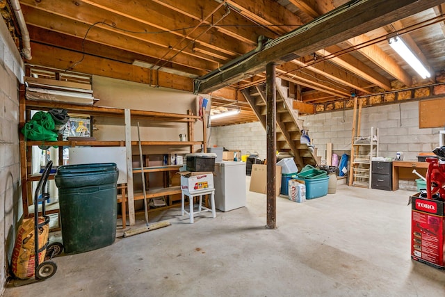 unfinished basement featuring concrete block wall