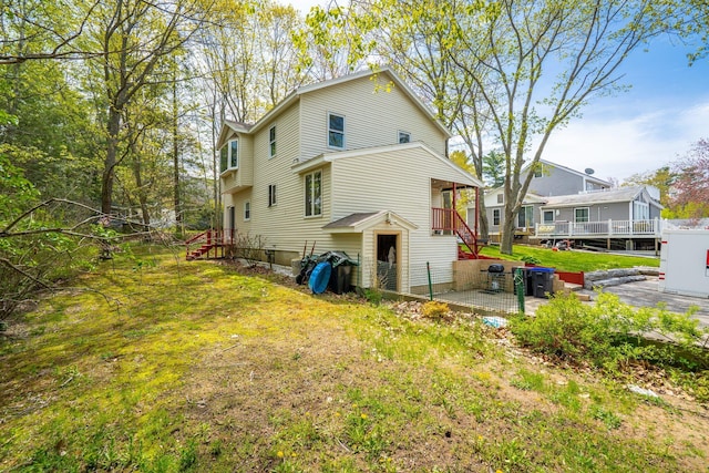 view of home's exterior featuring a patio area and stairs