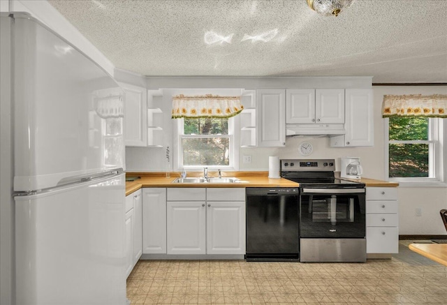 1270 Main St, Mount Desert, ME 04660 - kitchen with freestanding refrigerator, dishwasher, stainless steel electric range, under cabinet range hood, and a sink