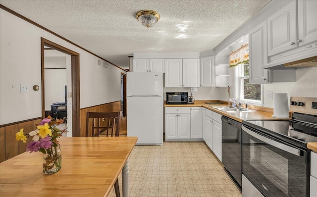 1270 Main St, Mount Desert, ME 04660 - kitchen featuring black appliances, a sink, wainscoting, under cabinet range hood, and a textured ceiling