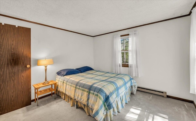 1270 Main St, Mount Desert, ME 04660 - carpeted bedroom with a baseboard heating unit, ornamental molding, a textured ceiling, and baseboards