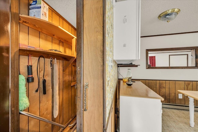 1270 Main St, Mount Desert, ME 04660 - detailed view of a baseboard radiator and a textured ceiling