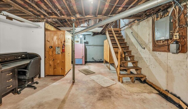 1270 Main St, Mount Desert, ME 04660 - unfinished basement featuring electric panel, stairway, and an office area