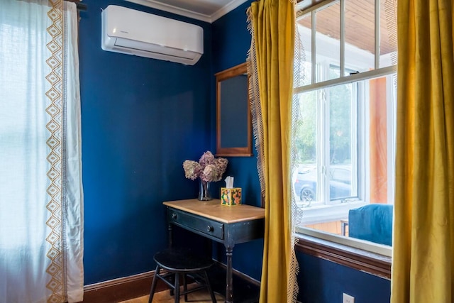 doorway to outside with a wall mounted AC, healthy amount of natural light, and ornamental molding