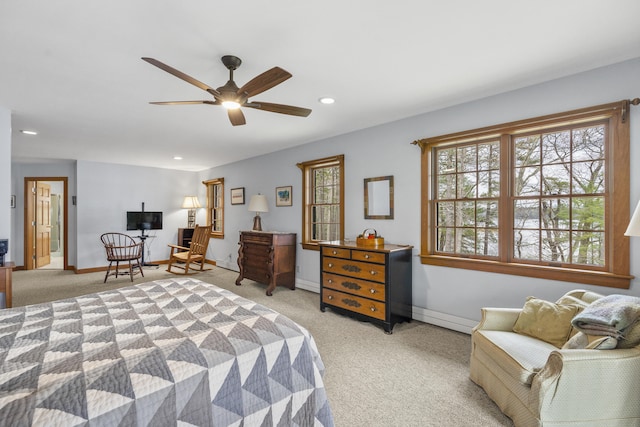 bedroom with light colored carpet, recessed lighting, baseboards, a baseboard heating unit, and ceiling fan
