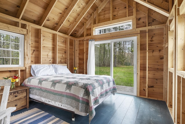 bedroom featuring access to outside, wood walls, beam ceiling, wood-type flooring, and high vaulted ceiling