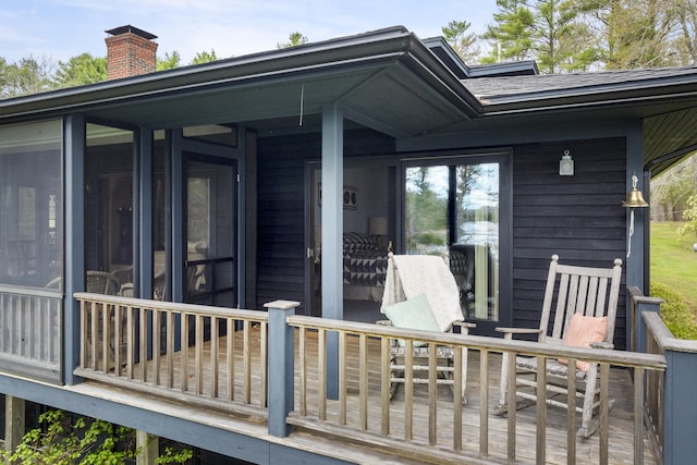 deck with a sunroom
