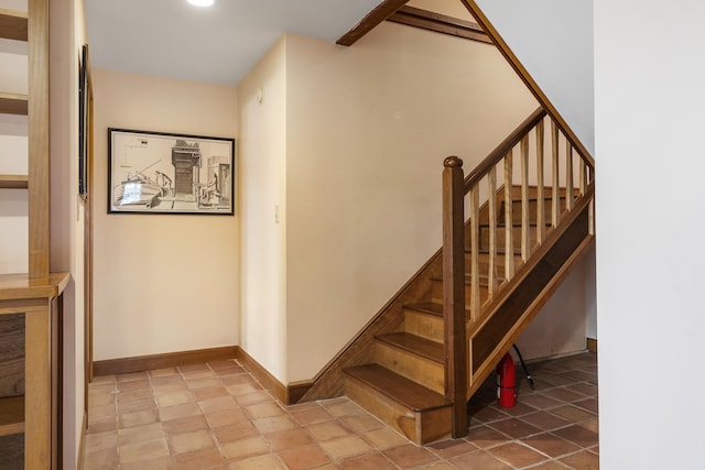 stairs featuring baseboards and recessed lighting