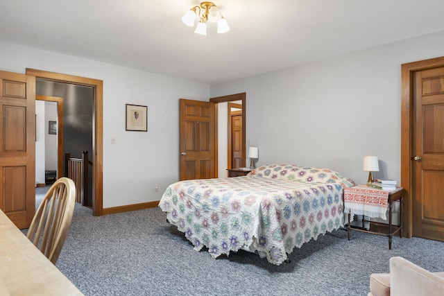 bedroom featuring carpet floors and baseboards