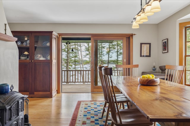 dining space featuring light wood finished floors