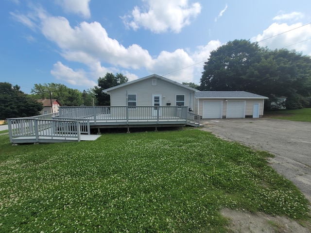 110 Lincoln St, Old Town, ME 04468 - view of front of house featuring a wooden deck, a detached garage, and a front lawn