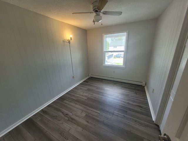 110 Lincoln St, Old Town, ME 04468 - empty room featuring a baseboard heating unit, dark wood finished floors, a textured ceiling, ceiling fan, and baseboards
