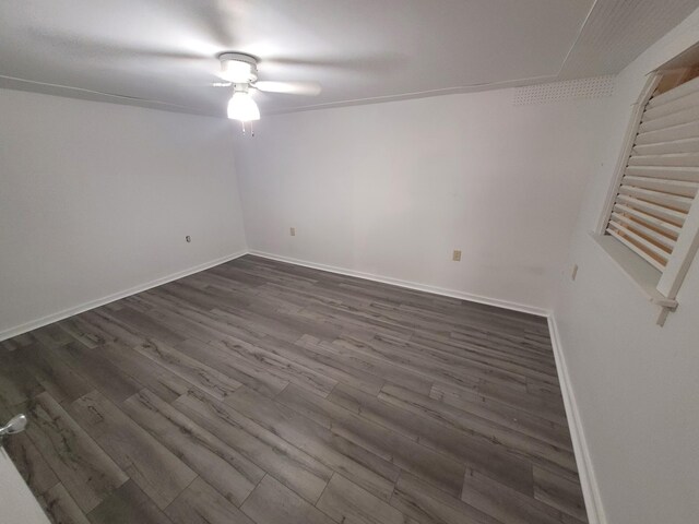 110 Lincoln St, Old Town, ME 04468 - spare room with dark wood-type flooring, a ceiling fan, and baseboards