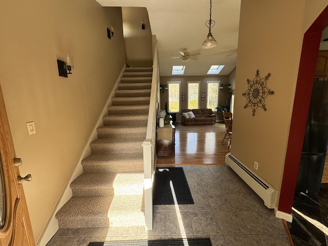 43 Webb River Dr, Dixfield, ME 04224 - tiled foyer featuring a baseboard radiator, stairs, ceiling fan, and baseboards