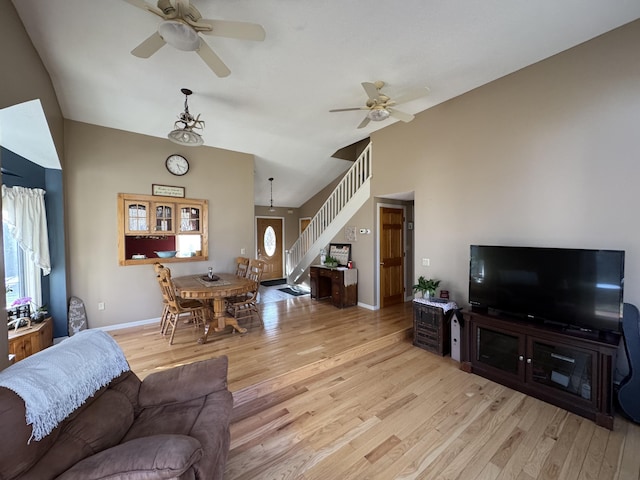 43 Webb River Dr, Dixfield, ME 04224 - living room featuring a ceiling fan, stairway, light wood-type flooring, and vaulted ceiling