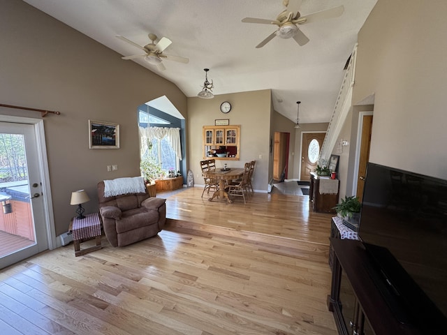 43 Webb River Dr, Dixfield, ME 04224 - living room featuring ceiling fan, light wood-style flooring, high vaulted ceiling, and baseboards