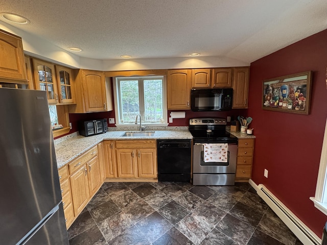 43 Webb River Dr, Dixfield, ME 04224 - kitchen featuring black appliances, baseboard heating, a sink, glass insert cabinets, and baseboards