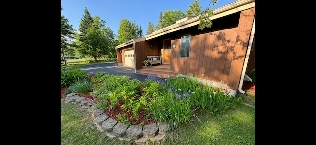 43 Webb River Dr, Dixfield, ME 04224 - view of home's exterior with a garage and asphalt driveway
