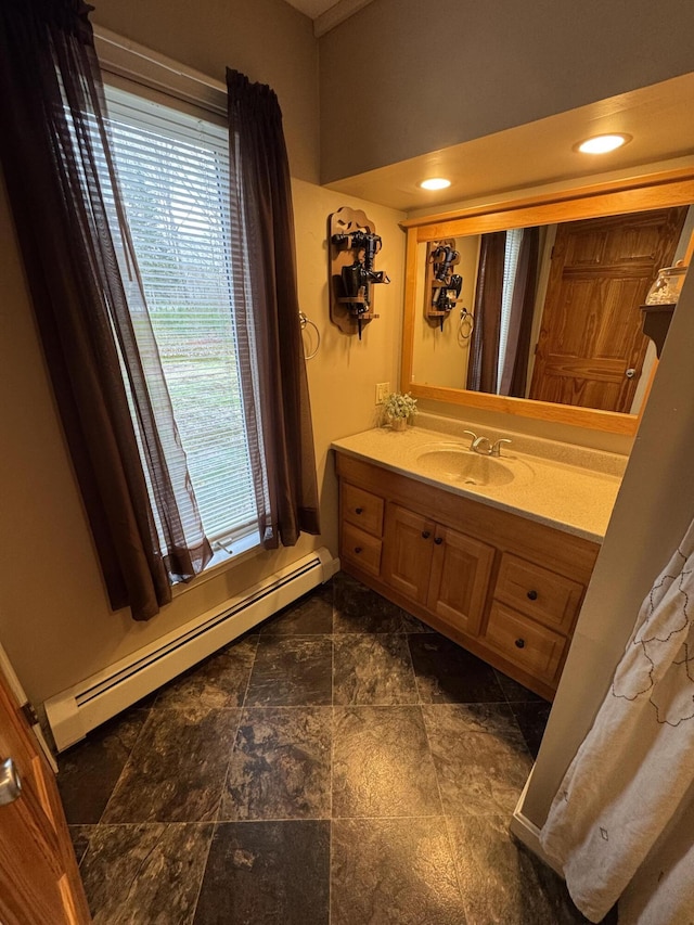 43 Webb River Dr, Dixfield, ME 04224 - bathroom with a baseboard heating unit, stone finish flooring, and vanity