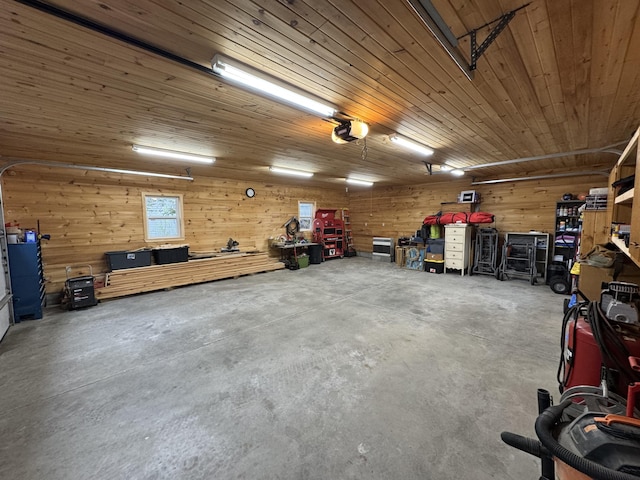 43 Webb River Dr, Dixfield, ME 04224 - garage with a garage door opener, a workshop area, wooden walls, and wood ceiling