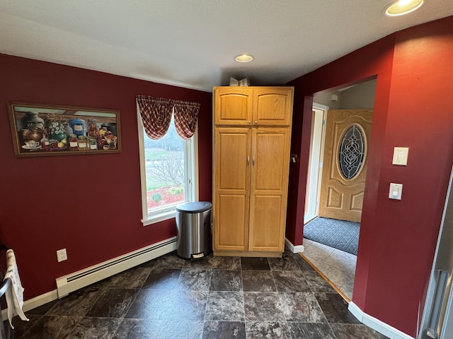 43 Webb River Dr, Dixfield, ME 04224 - unfurnished dining area with baseboard heating, baseboards, dark stone finish floors, and recessed lighting