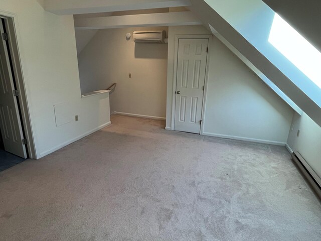 bonus room with a wall mounted AC, carpet floors, a skylight, vaulted ceiling, and a baseboard radiator