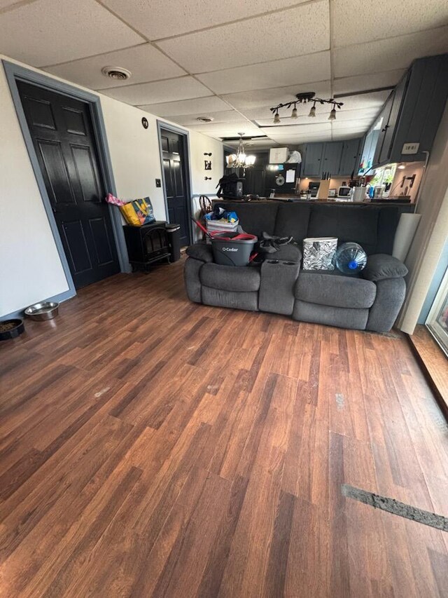623 Gore Rd, Otisfield, ME 04270 - living area featuring wood finished floors and a drop ceiling