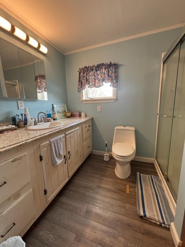 623 Gore Rd, Otisfield, ME 04270 - bathroom featuring a stall shower, ornamental molding, wood finished floors, vanity, and baseboards
