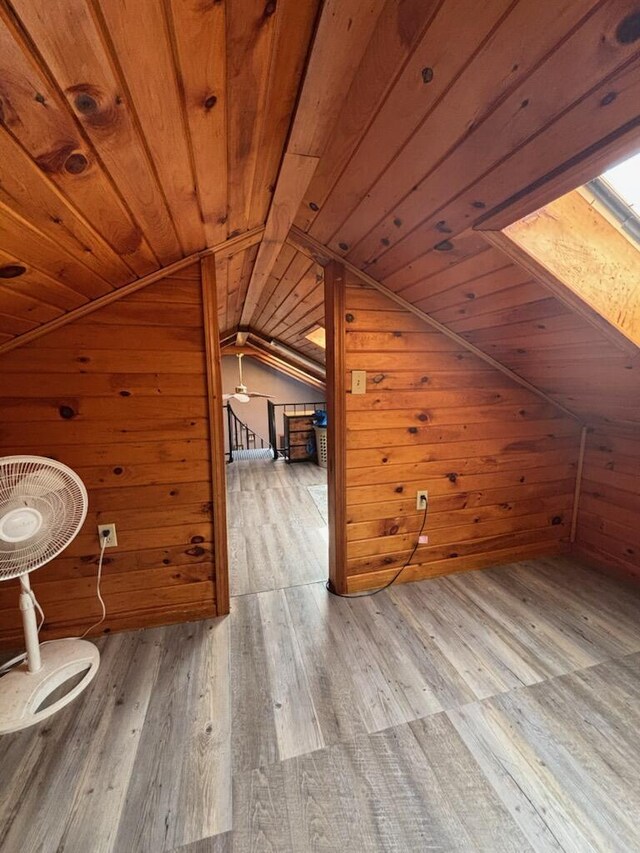 623 Gore Rd, Otisfield, ME 04270 - additional living space featuring wooden walls, wood ceiling, vaulted ceiling, hardwood / wood-style flooring, and a skylight