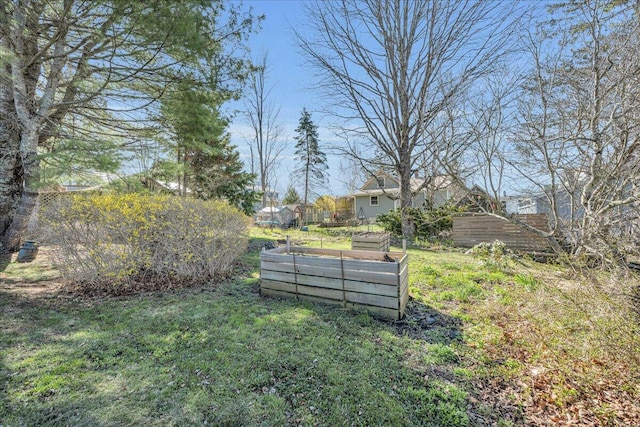 view of yard featuring a garden and fence