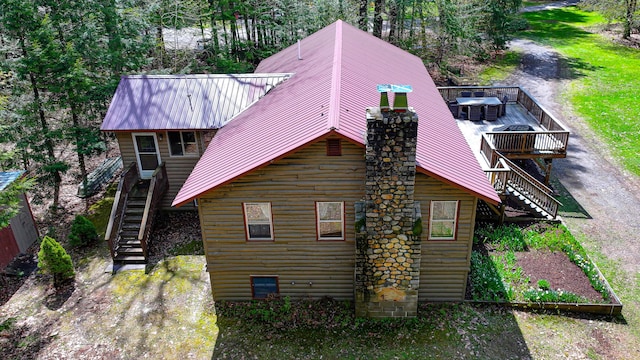 124 Alpine Village Rd, Harrison, ME 04040 - back of house with stairs, metal roof, a wooden deck, and log veneer siding