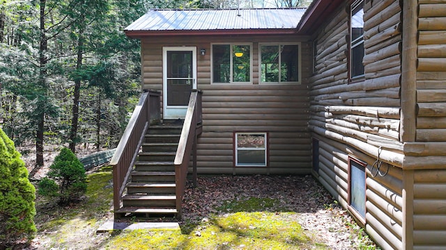 124 Alpine Village Rd, Harrison, ME 04040 - view of home's exterior with faux log siding and metal roof