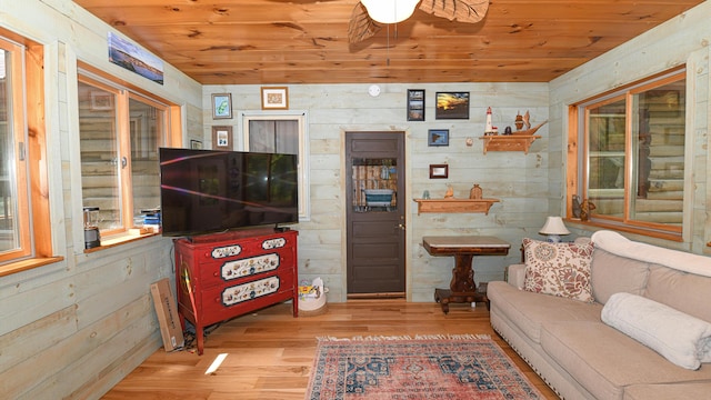 124 Alpine Village Rd, Harrison, ME 04040 - living area featuring wooden ceiling, wood finished floors, wood walls, and a ceiling fan