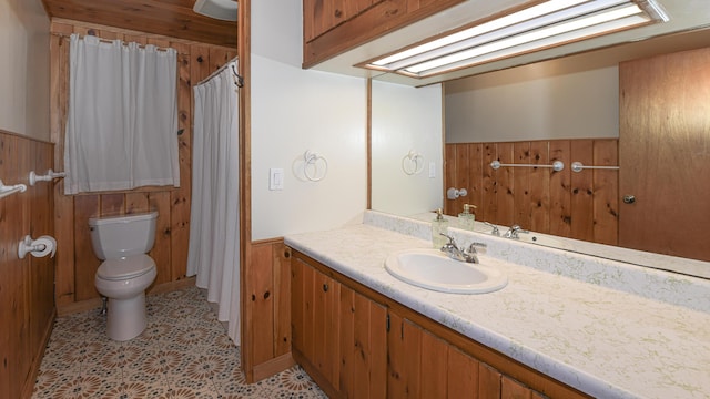 124 Alpine Village Rd, Harrison, ME 04040 - full bathroom featuring toilet, a wainscoted wall, vanity, and wood walls