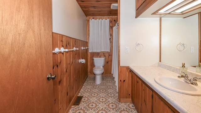 124 Alpine Village Rd, Harrison, ME 04040 - bathroom with toilet, wooden walls, a wainscoted wall, vanity, and wood ceiling