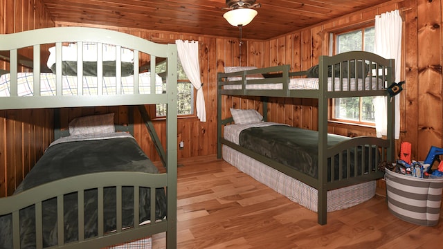 124 Alpine Village Rd, Harrison, ME 04040 - bedroom with wood walls, wood ceiling, and wood finished floors