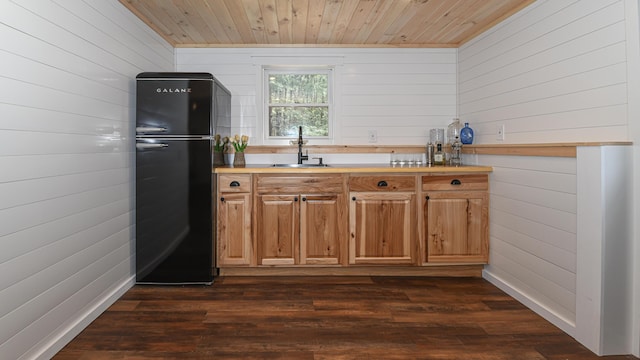 124 Alpine Village Rd, Harrison, ME 04040 - kitchen with freestanding refrigerator, a sink, wood walls, wooden ceiling, and dark wood-style floors