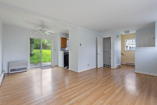 30 Glenridge Dr Unit 30, Portland, ME 04102 - unfurnished living room with light wood-style floors, ceiling fan, a baseboard heating unit, heating unit, and baseboards