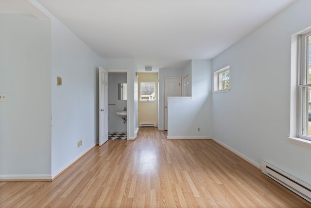 30 Glenridge Dr Unit 30, Portland, ME 04102 - unfurnished room featuring baseboard heating, light wood-style floors, and baseboards