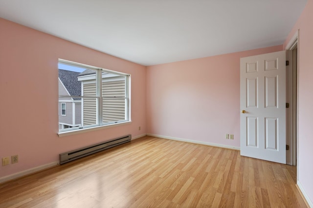 30 Glenridge Dr Unit 30, Portland, ME 04102 - spare room with baseboard heating, light wood finished floors, and baseboards