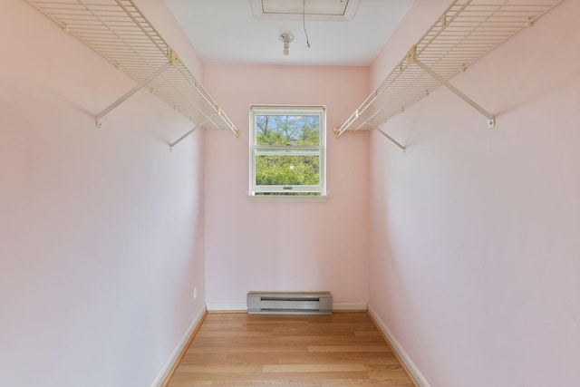 30 Glenridge Dr Unit 30, Portland, ME 04102 - walk in closet featuring baseboard heating, light wood-style floors, and attic access