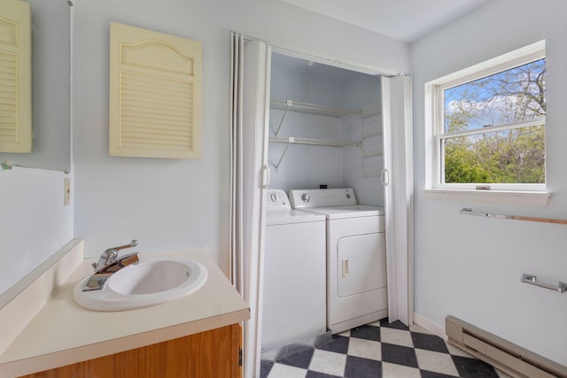 30 Glenridge Dr Unit 30, Portland, ME 04102 - bathroom featuring tile patterned floors, washer and clothes dryer, a baseboard radiator, and vanity