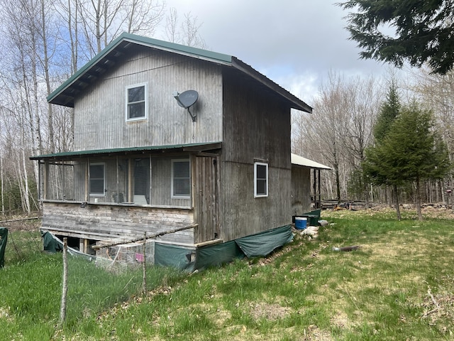 173 Ham Dr, Springfield, ME 04487 - rear view of house featuring a yard