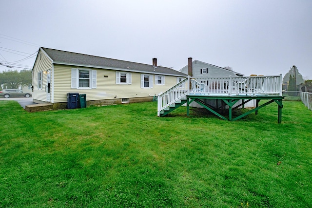 back of house with a deck and stairs