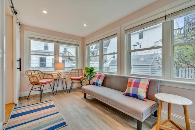 4 Union Ave, Old Orchard Beach, ME 04064 - sunroom with healthy amount of natural light, baseboards, recessed lighting, wood finished floors, and a barn door